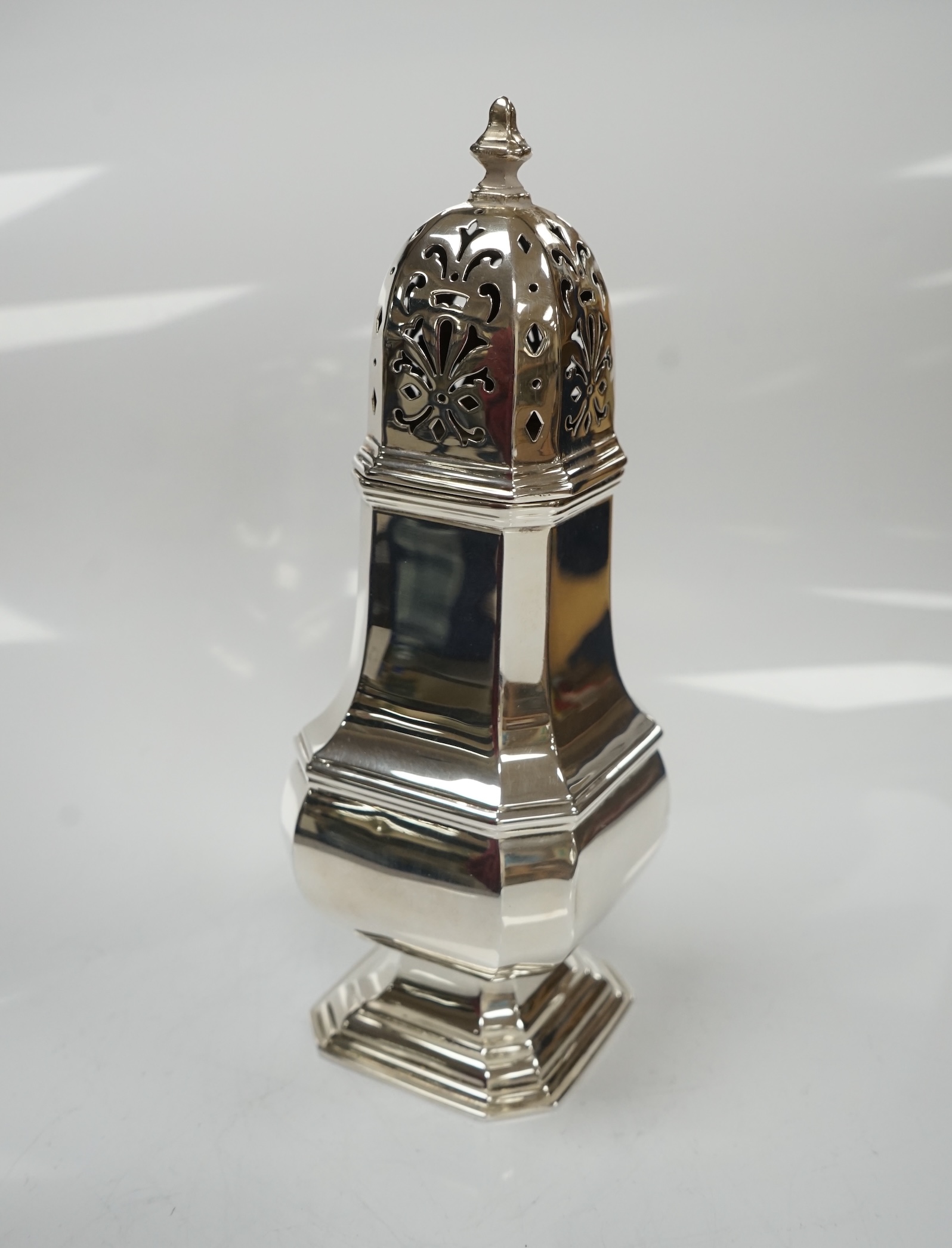 A George V silver octagonal baluster sugar castor, by Adie Bros, height 18.3cm, 5.3oz. Condition - poor